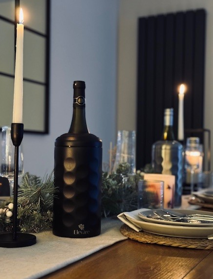 Black Elevare wine cooler - chillng wine on table with decorations